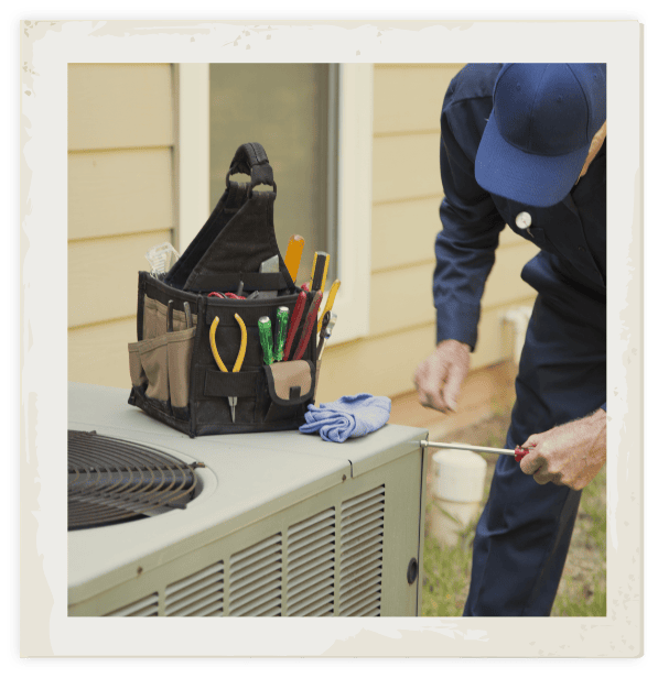 HVAC maintenance technician performing heating and cooling maintenance in the Hall County area.